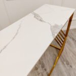 azure gold console table with polar white sintered top